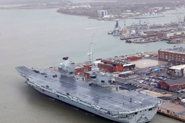 HMS Queen Elizabeth, Britain's biggest warship, during her commissioning ceremony into the Royal Navy Fleet at Portsmouth Naval Base.