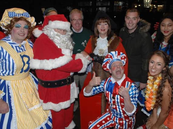 The Mayor of Harrogate Coun Anne Jones, Father Christmas and Coun John Fox  switch on The Harrogate Christmas Lights with help from the cast of Harrogate Theatre's production of Beauty and the Beast and entertainers. Picture:
 Adrian Murray (1711162AM19).
