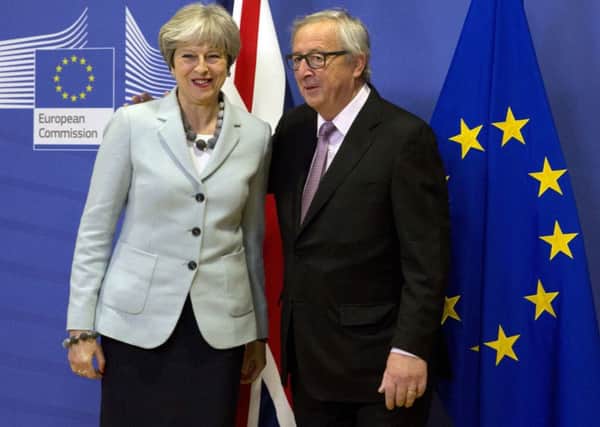 Theresa May and Jean-Claude Juncker after the breakthrough in Brexit talks.