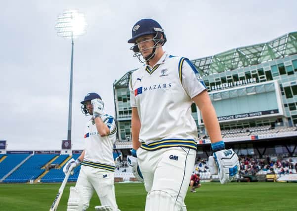 OPENING UP: Yorkshire's Alex Lees, right, and Adam Lyth walk out to bat on the opening day of the 2017 season. Picture by Alex Whitehead/SWpix.com
