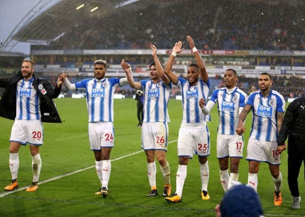 Christopher Schindler, No 26, and team-mates applaud the fans after Huddersfield Town's win over Manchester United (Picture: Nigel French/PA Wire).