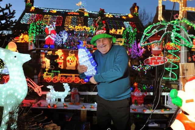 8 December 2017....     Eric Marshall, 77, with his house decorated with Christmas lights in Bagby near Thirsk.  Picture Tony Johnson.