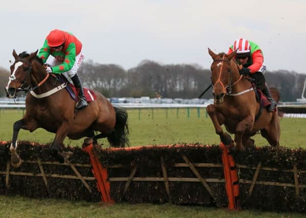 Definitly Red (right) is in action at Aintree today.