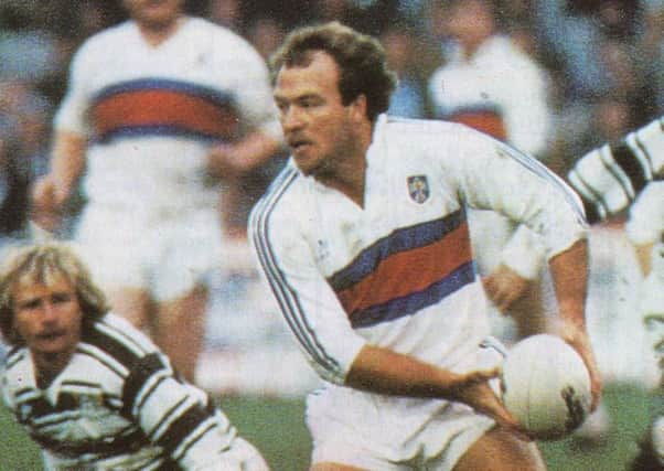 BIG MONEY: Wally Lewis on his Wakefield debut. Grounded in the background is Hull's Peter Sterling, Lewis's famous Kangaroos half-partner. Pic courtesy of Wakefield Trinity.