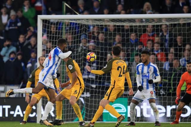 Huddersfield Town's Steve Mounie (left) scores his side's second goal.