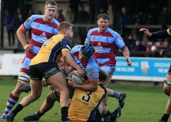 Titans' James Lasis is locked up two Ealing Trailfinders' (Picture: Chris Etchells)