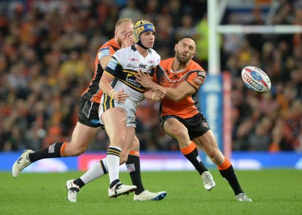 ASSURED: Jack Walker releases the ball as Luke Gale challenges in this year's Super League Grand Final at Old Trafford.  Picture Bruce Rollinson