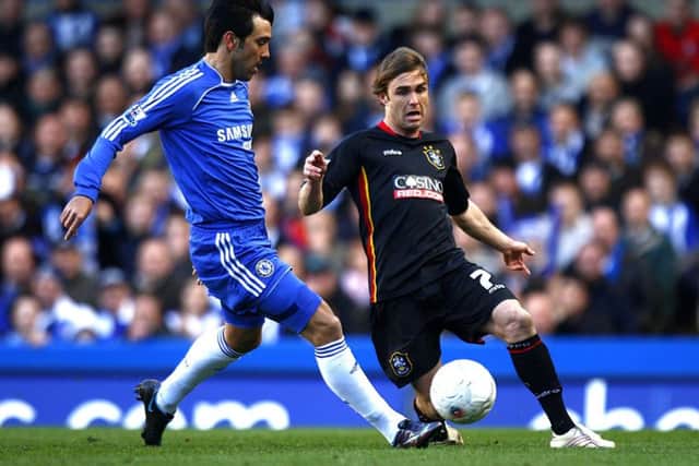 Huddersfield Town's Andy Holdsworth (r) battles for the ball with Chelsea's Paulo Ferreira during the FA Cup Fifth Round match at Stamford Bridge, London in 2008