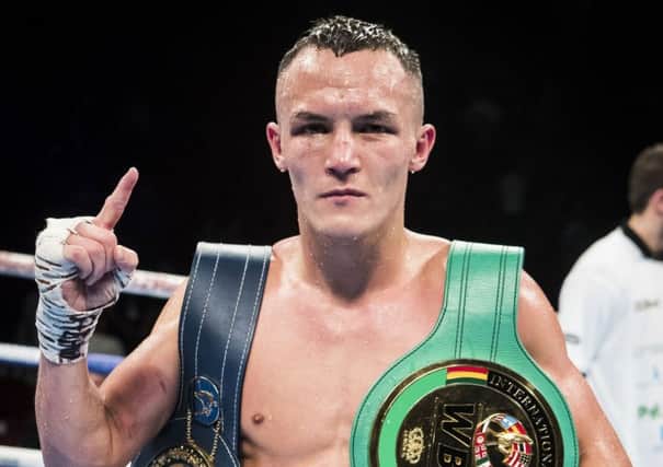 Josh Warrington celebrates after beating Dennis Ceylan at the First Direct Arena, Leeds in October (Picture: Danny Lawson/PA Wire).