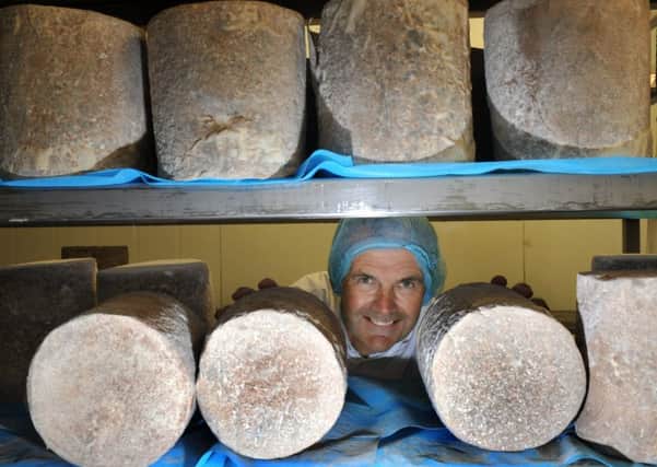 110816  David Hartley Managing Director of Wensleydale Creamery amongst the cheeses  made at the Wensleydale Creamery at Hawes. for Vision.
