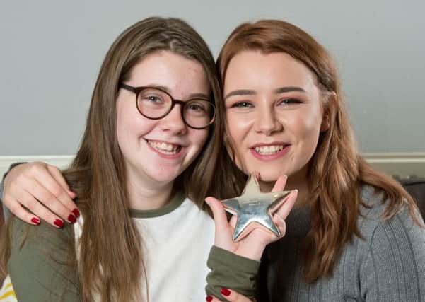 Aliscia Coe, left, is pictured with sister Chelsea, and the Cancer Research UK Kids and Teens awared she was given ten years ago.
Photograph by Richard Walker/ www.imagenorth.net