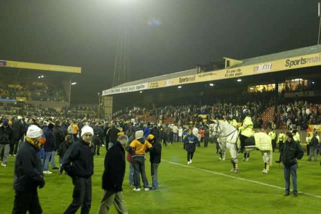 Hull City supporters staged a good-natured pitch invasion to mark the end of their team's last-ever match at the Boothferry Park ground. Picture: John Jones.