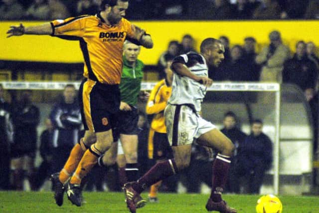 LAST NIGHT: Hull City's Ian Ashbee (left), fails to catch Darlington's Ashley Nicholls during the club's last match at Boothferry Park. Picture: John Jones./PA.