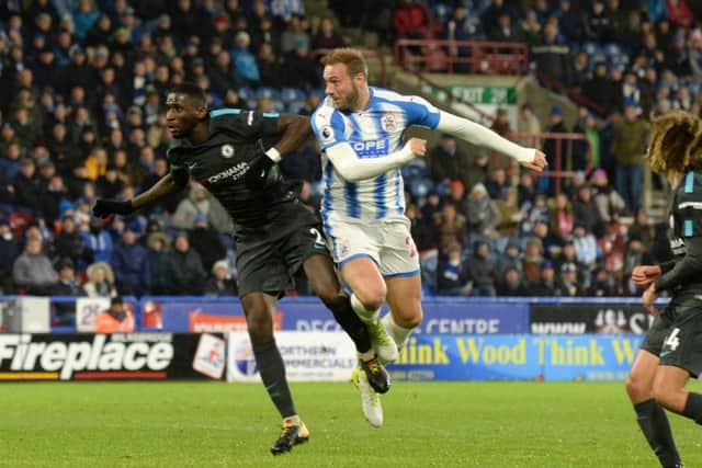 Laurent Depoitre heads in his injury-time goal for Huddersfield Town against Chelsea. Picture: Bruce Rollinson.