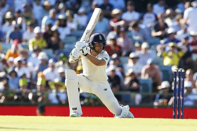 England's Dawid Malandrives through the off side on his way to a century on day one at the WACA. Picture: Jason O'Brien/PA