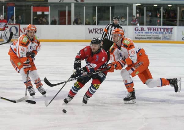 Sheffield Steelers' Jonathan Phillips and team-mate Davey Phillips battle hard for the puck at Dundee on Wednesday night. Picture: Derek Black/EIHL.