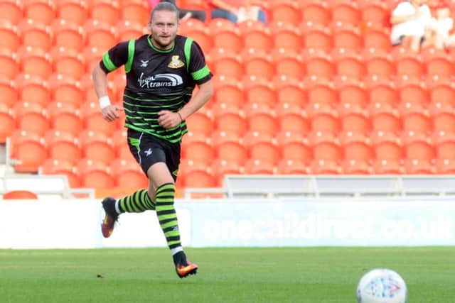 Doncaster Rovers' Alfie May was playing in the eighth tier of English football this time last year with Hythe Town.