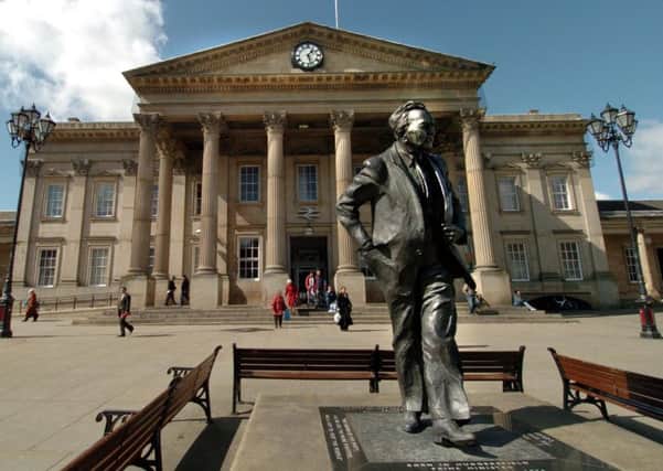 Harold Wilson's statue outside Huddersfield Station, but is the town missing out on express rail services?