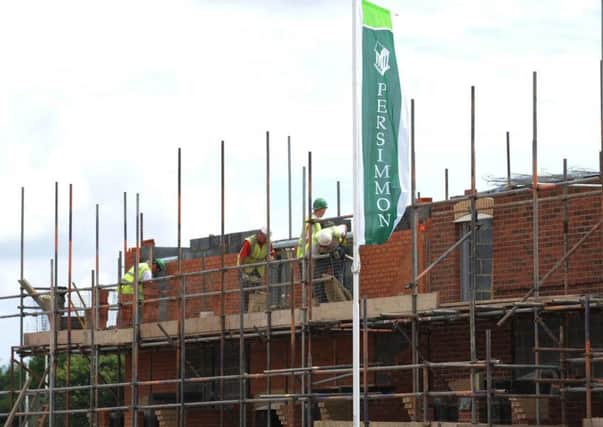 Building work continues at the Portland site of housebuilder Persimmon in Ashington, Northumberland, after it was announced that it had cut 1,100 jobs so far this year. PRESS ASSOCIATION Photo. Picture date: Tuesday July 8, 2008. The York-based group, which trades as Charles Church, Persimmon Homes and Westbury Partnerships, said the past six months had "undoubtedly been the most challenging period" in its recent history. See PA story CITY Persimmon. Photo credit should read: Owen Humphreys/PA Wire