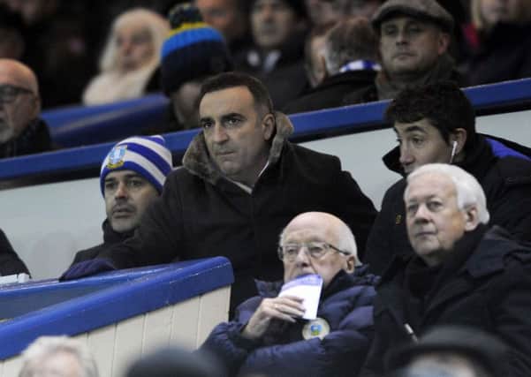 Sheffield Wednesday head coach Carlos Carvalhal, centre, had to serve a one-match touchline ban and saw his team lose to Wolverhampton Wanderers on Friday night (Picture: Steve Ellis).