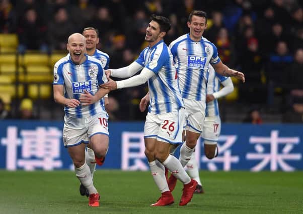 Huddersfield Town's Aaron Mooy (left) celebrates scoring his side's second goal.