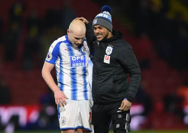 Huddersfield Town's Elias Kachunga (right) and Aaron Mooy celebrate victory.
