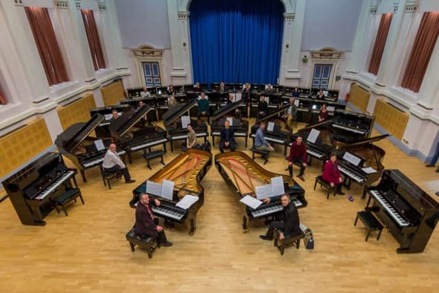 The 27 new Steinway pianos, and one which the University already owned,  in its concert hall. PIC: James Hardisty