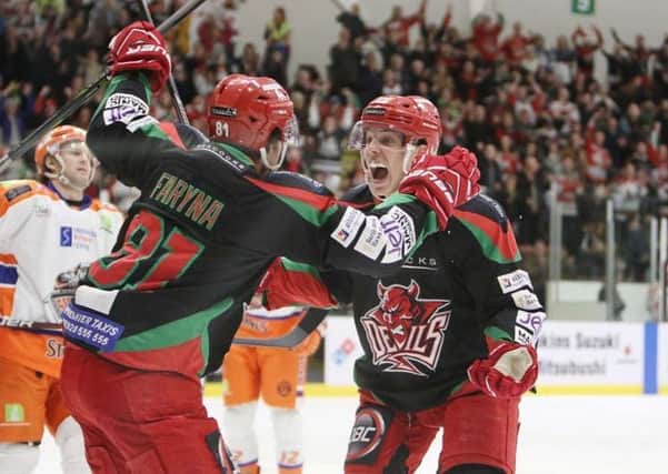 Cardiff Devils' players celebrate one of their four goals against Sheffield Steelers on Saturday night. Picture: Helen Brabon/EIHL
