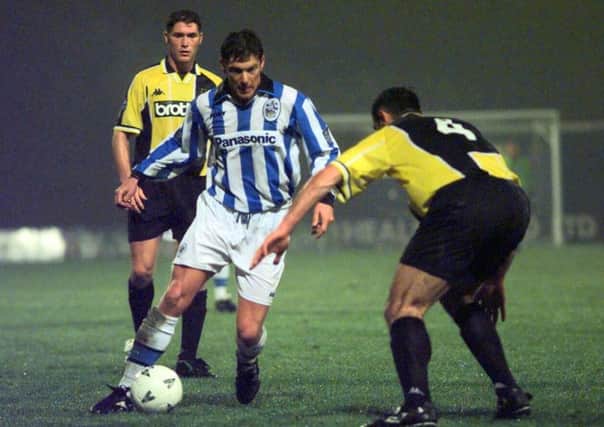 INFLUENTIAL: Huddersfield Town's Paul Dalton tries to get past Manchester City's Murtaz Shelia during the 1997-98 season.
 Picture: Bruce Rollinson