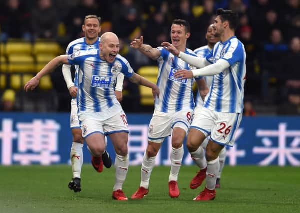 CATCH ME IF YOU CAN: Huddersfield Town's Aaron Mooy (left) celebrates scoring his side's second goal of the game against Watford. Picture: Daniel Hambury/PAgle club/league/player publications.