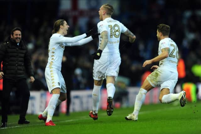 Leeds United's Pontus Jansson, centre, celebrates scoring what proved the only goal of the game against Norwich City (Picture: Simon Hulme).