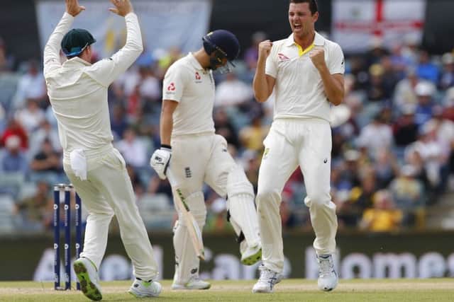 Australia's Josh Hazelwood celebrates the wicket of England's Dawid Malan at the WACA. Picture: Jason O'Brien/PA