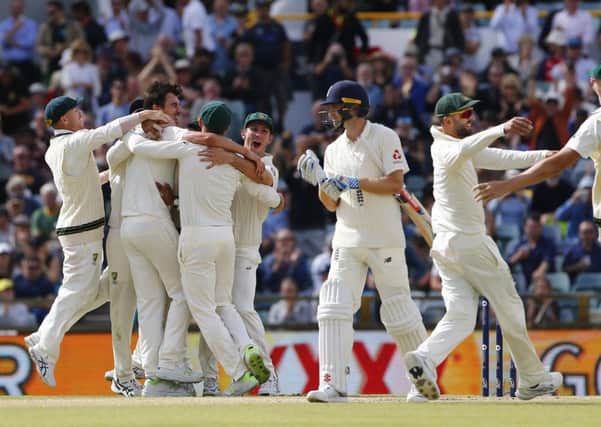 Australia celebrate the final wicket to win the ashes during day five at the WACA. Picture: Jason O'Brien/PA