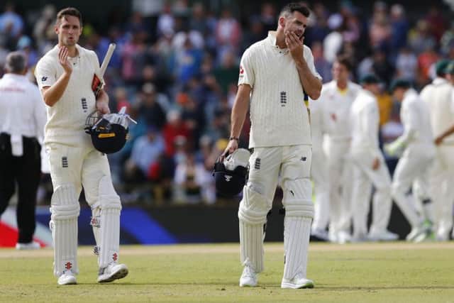 England's James Anderson and Chris Woakes look dejected after Australia win The Ashes at the WACA. Picture: Jason O'Brien/PA