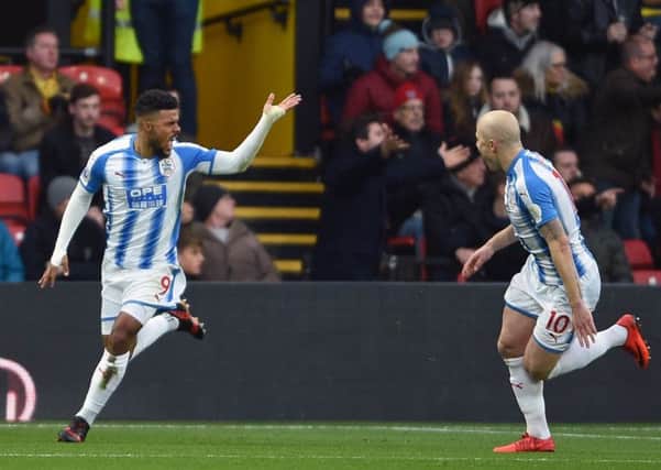 Huddersfield Town's Elias Kachunga celebrates scoring his side's first goal at Vicarage Road. Picture: Daniel Hambury/PA