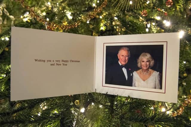 The Prince of Wales and Duchess of Cornwall's 2017 Christmas card on a Christmas tree in Clarence House, London.