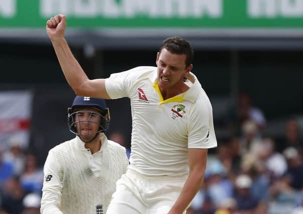 Australia's Josh Hazelwood celebrates the wicket of England's Craig Overton