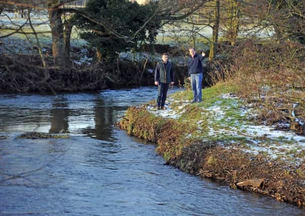 Richard Murray Wells, right, with Max Ward by the River Rye which runs through the farmland at Ness Hall. Pictures by Tony Johnson.