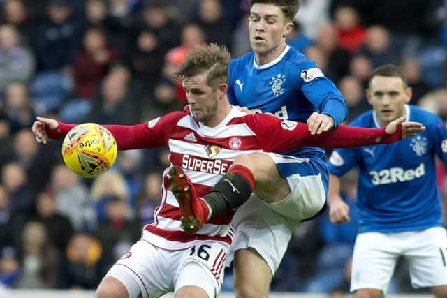 Josh Windass pictured playing for Rangers and tangling with Hamilton's David Templeton (Picture: PA Wire).