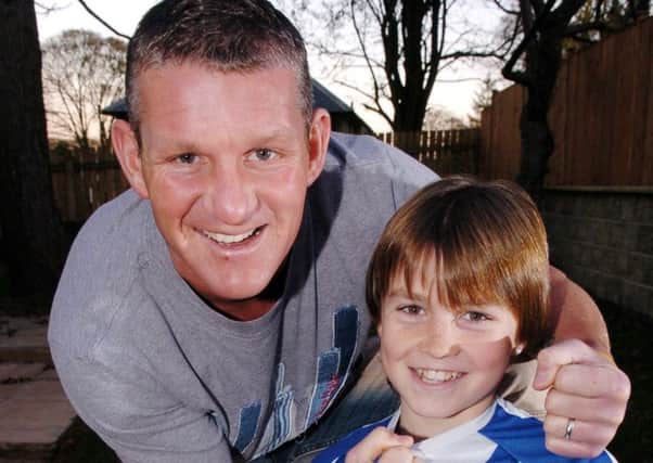 Dean Windass pictured with his son Josh 11 years  ago. Dean was a Bradford City player at the time while Josh was making his way in Huddersfield Towns academy (Picture: Bruce Rollinson).