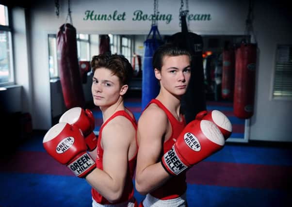 Leeds boxing brothers Ellis and Hope Price, both of whom have won notable titles this year, pictured at The Hunslet Club.
 (Picture: Jonathan Gawthorpe)