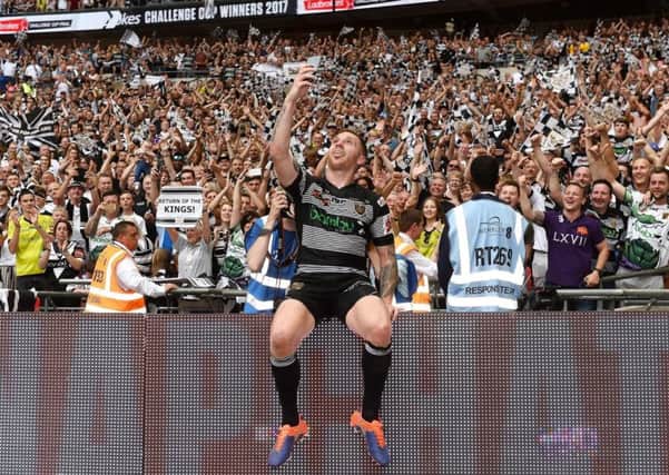 Marc Sneyd of Hull FC takes a selfie with the Hull FC crowd at Wembley.