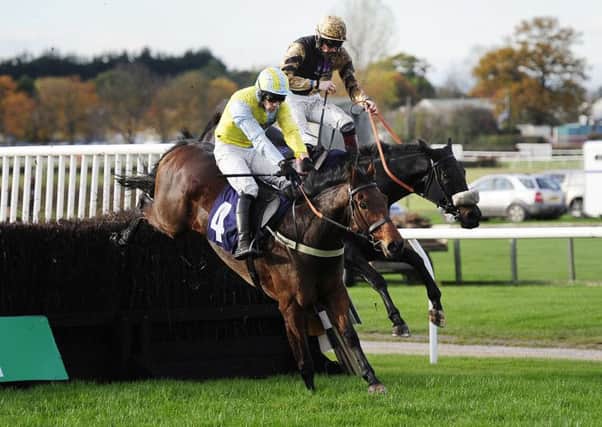 Jockey Sam Twiston-Davies (right), who finished second, is shot from the saddle on Fago as he challenges eventual winner Wakanda and Danny Cook at the final fence in the bet 365 Handicap Chase during the bet365 Charlie Hall Meeting at Wetherby Racecourse. (Picture: John Giles/PA Wire)