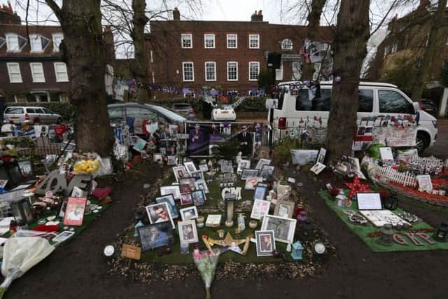 Tributes left opposite the home of singer George Michael in The Grove, Highgate, London, on the anniversary of his death. Picture: Jonathan Brady/PA Wire