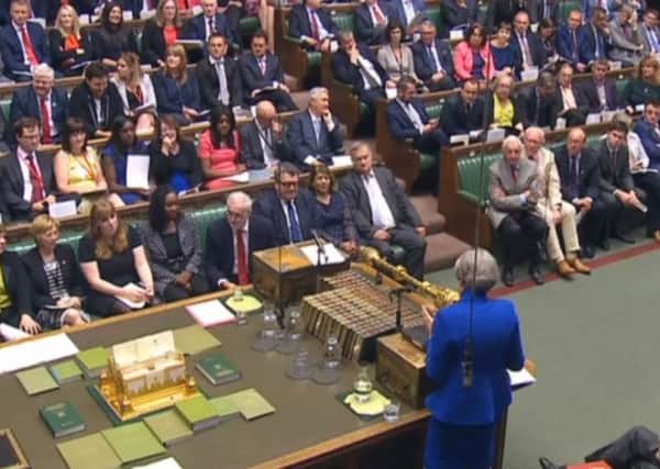 Theresa May at a combative PMQs, but do MPs have more in common?