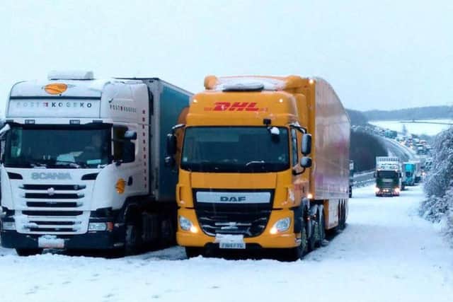 Picture taken with permission from the twitter feed of @simontab of stuck lorries between J2 and J1 after overnight snow caused travel disruptions across parts of the UK.
