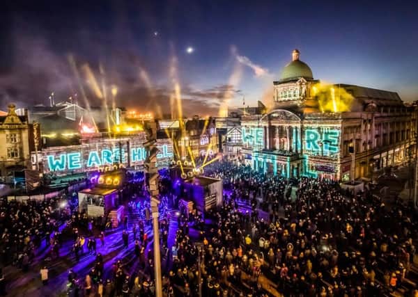 We Are Hull by artist Zolst Balogh is projected onto buildings in the city's Queen Victoria Square, marking the official opening of Hull's tenure as UK City of Culture.  Photo: Danny Lawson/PA Wire