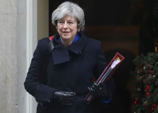 Will Theresa May be shown the exit door in 2018 or will she be able to implement Brexit?