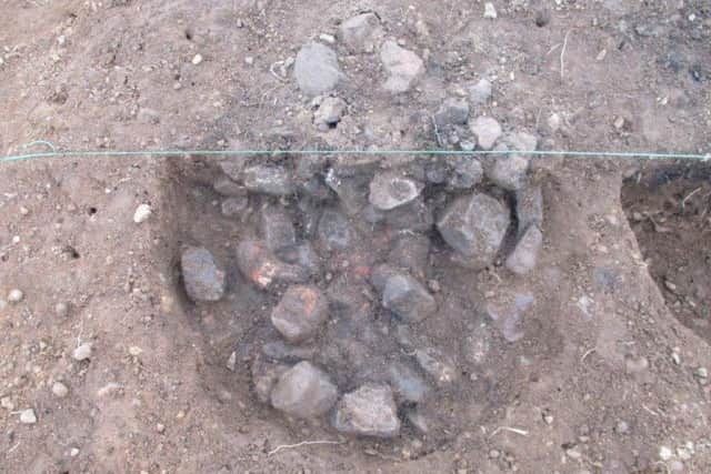 The intriguing pit of burned stones found at Little Catwick Quarry