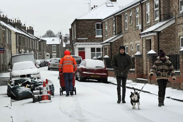 People walk through the snow in York. PIC: PA